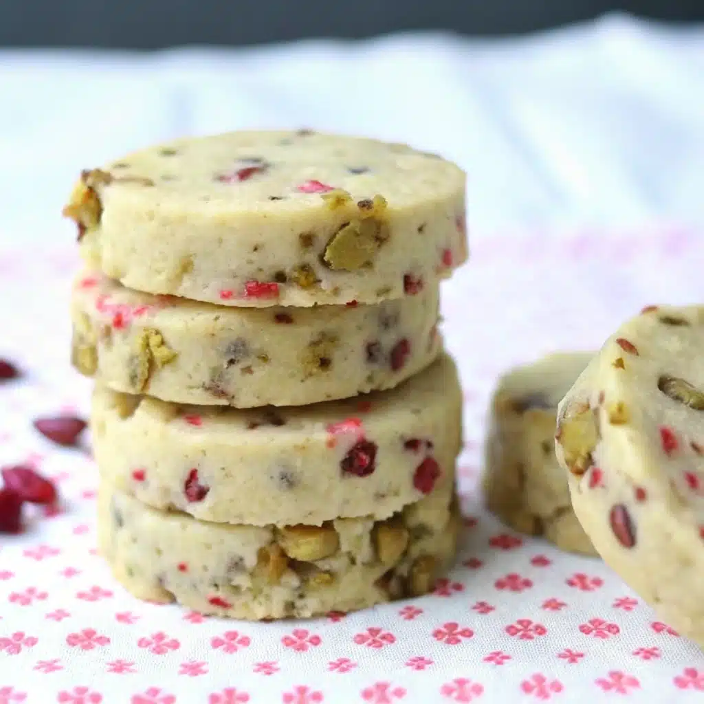 Cranberry pistachio shortbread cookies stacked on plate