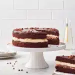fixing ganache on tuxedo cake
