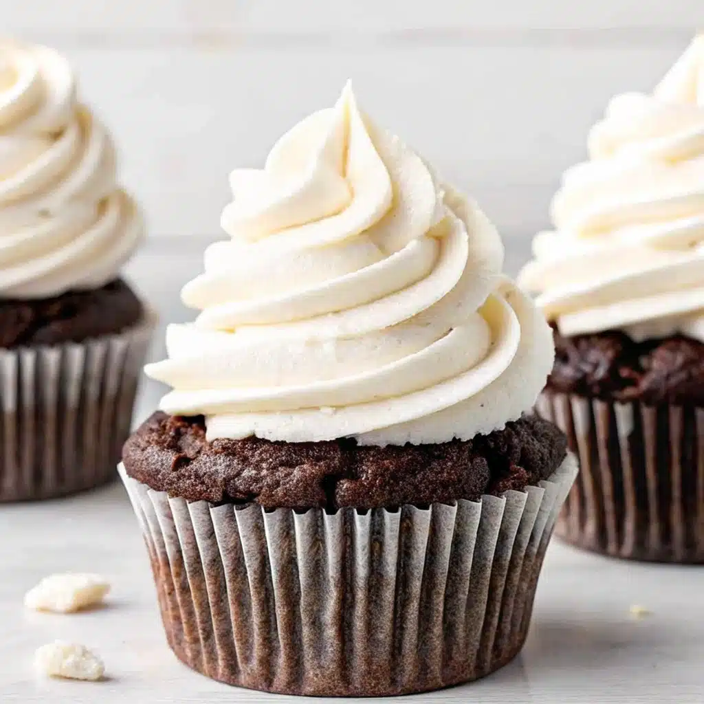 Marshmallow frosting piped onto cupcake