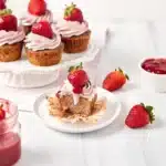 Strawberry cupcakes with strawberry filling topped with buttercream
