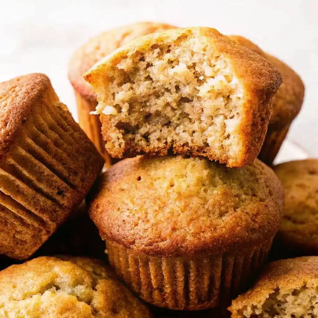 freshly baked 2 banana muffins on a wooden kitchen counter