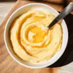 Whipped honey butter creamy spread in glass bowl