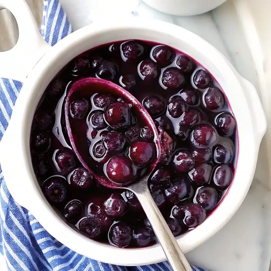 Blueberry compote simmering with lemon zest