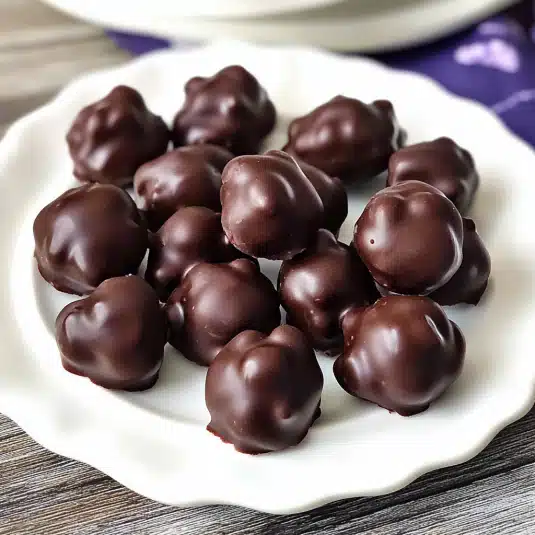 Chocolate covered blueberries in a white bowl