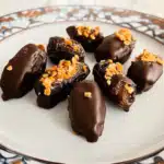 Chocolate covered dates with sea salt on tray