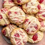Soft Lemon Raspberry Cookies on cooling rack with lemon zest