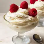 Vanilla mousse in elegant glass cups with vanilla bean specks