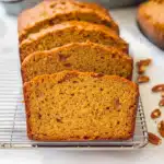 Freshly baked sweet potato bread sliced on a cooling rack, showing a moist golden interior — easy one-bowl recipe for fall baking