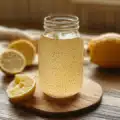 Natural Mounjaro recipedrink made with lemon, chia seeds, and ginger on a wooden table, glowing in natural light a healthy detox beverage.